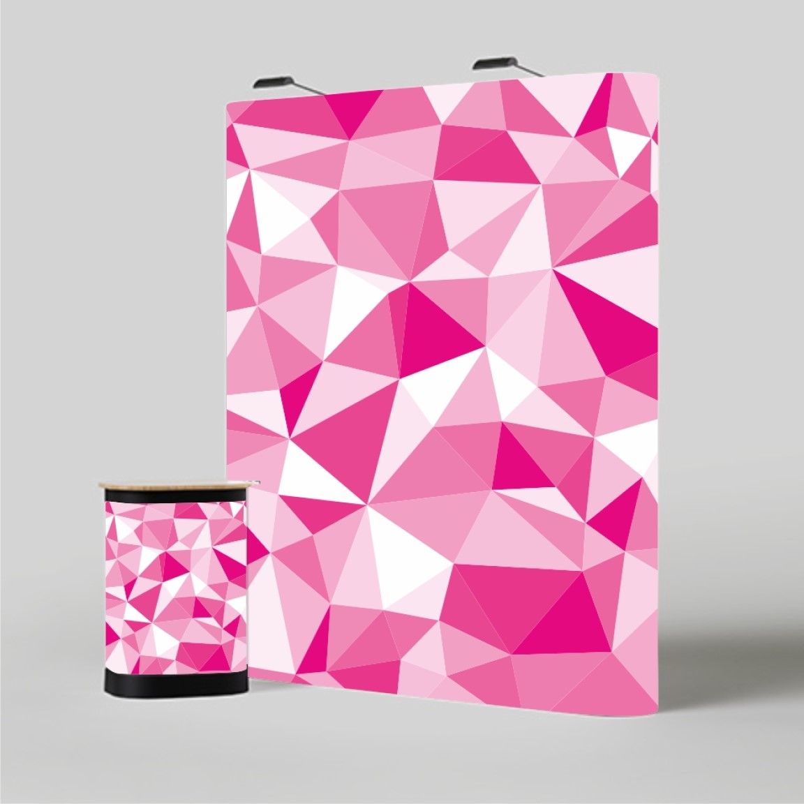 Straight pop-up display stand with a curved-free pink printed backdrop, showing a professional exhibition display system with branded graphics and integrated lighting.