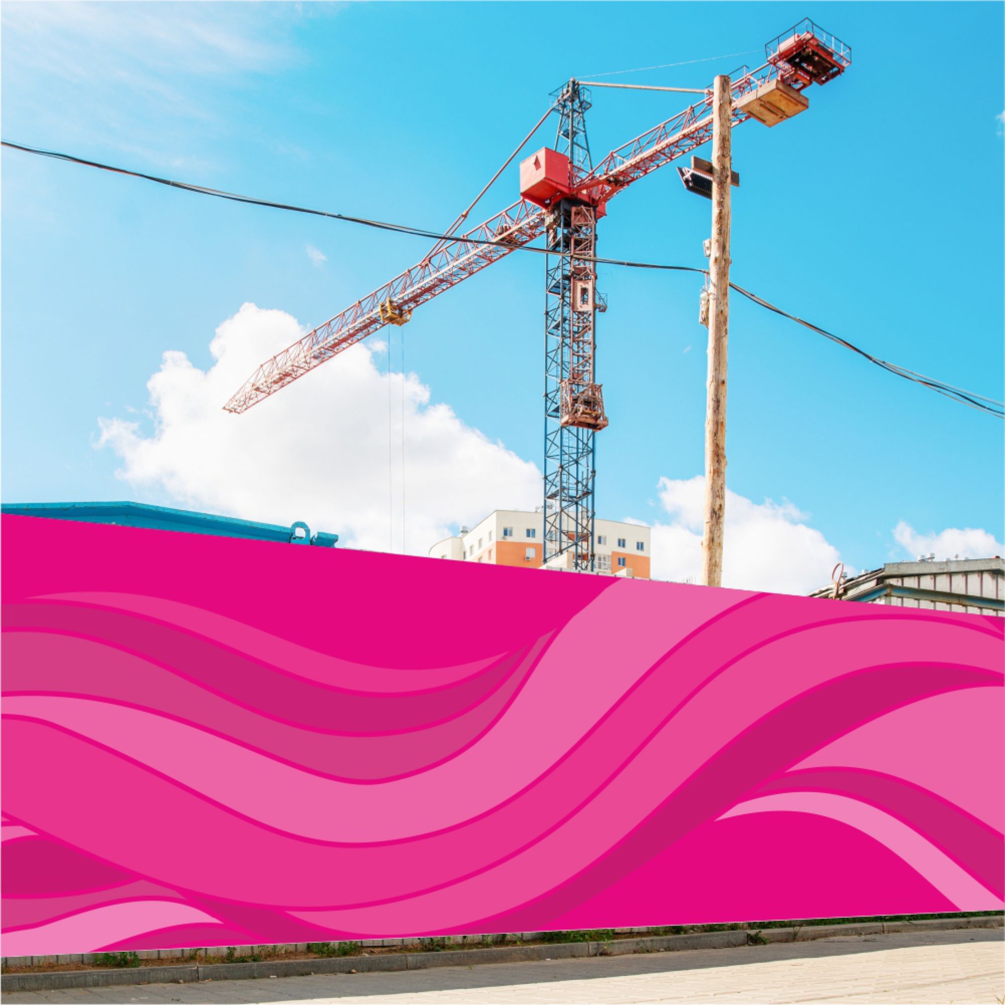 Printed hoarding boards installed outside a construction site with a crane visible in the background.