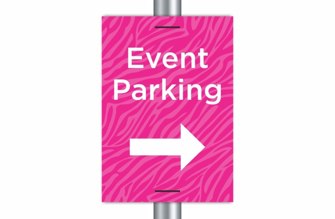 A lightweight Correx® lamppost sign fixed securely to a streetlight, displaying clear directional information for an upcoming event. The sign is outdoors and designed for temporary use.